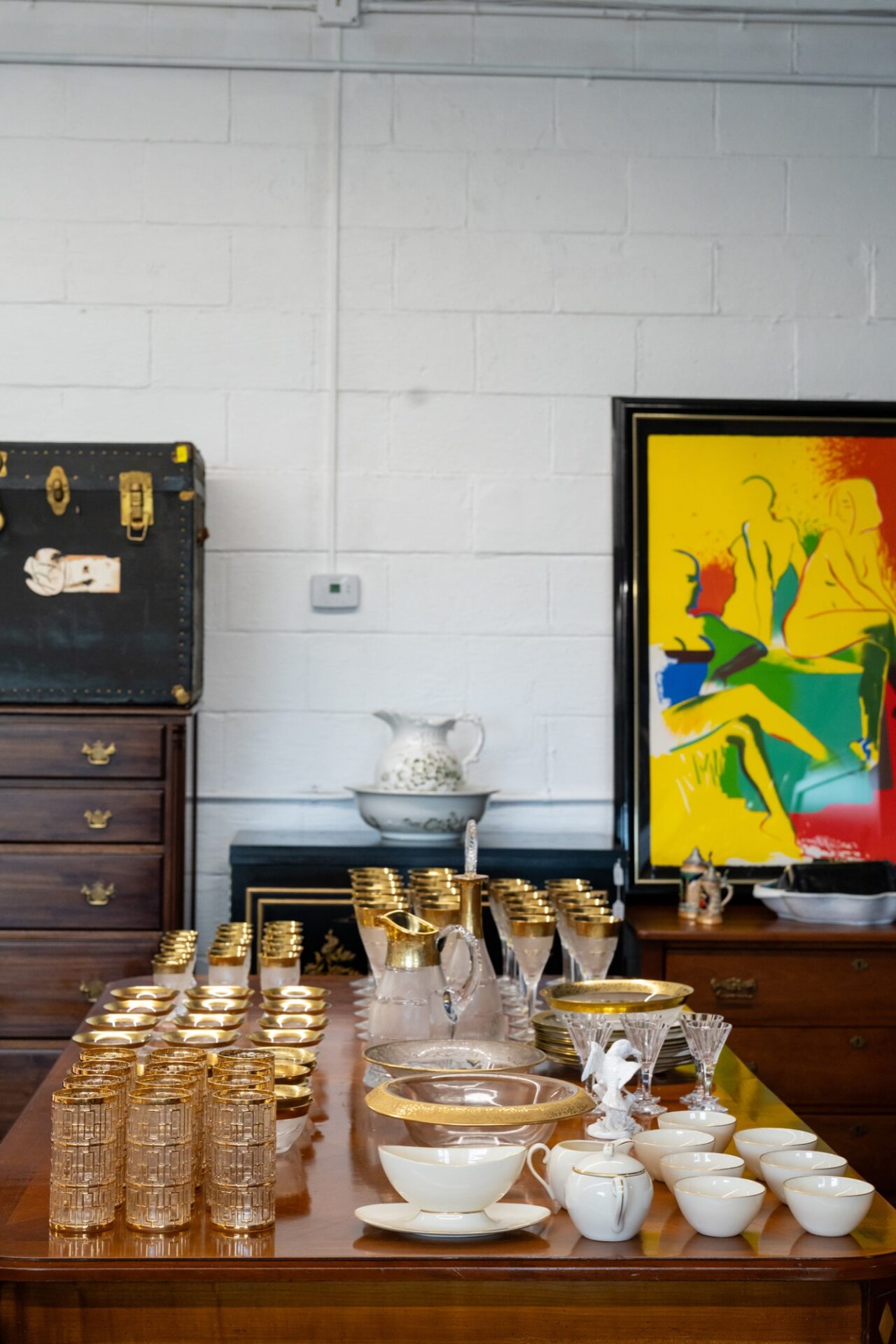 Gilded glassware, china, and antique furniture at Manzi Appraisers