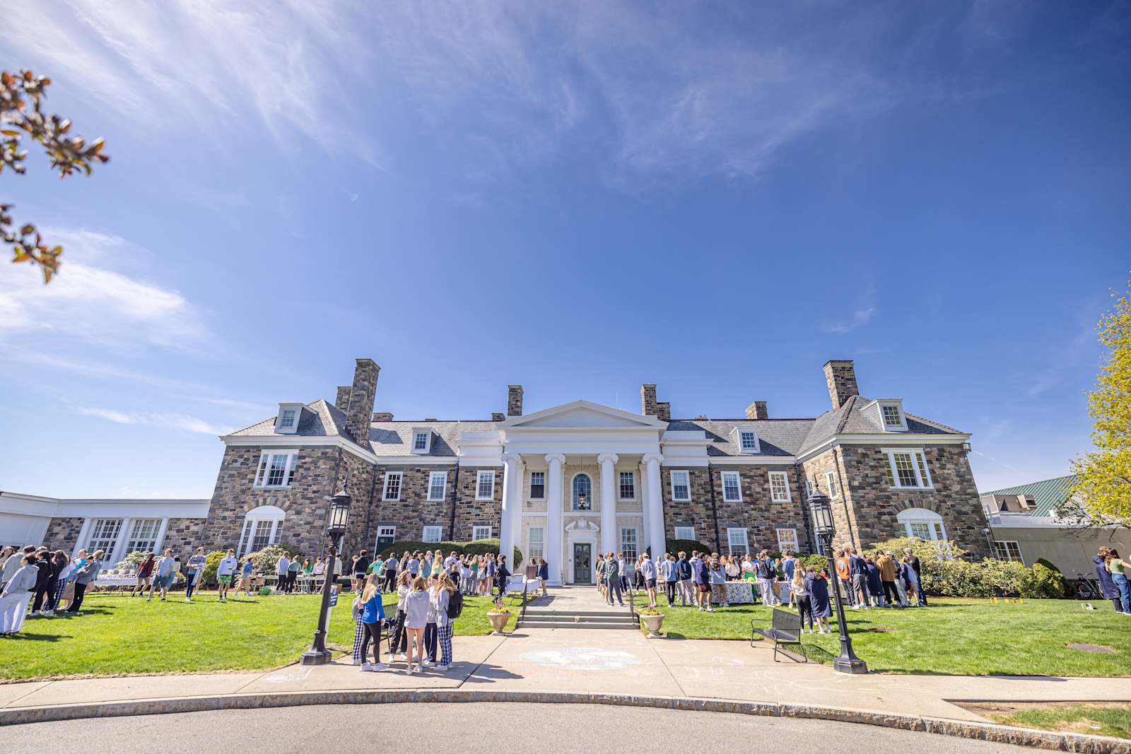 Students gathered on the lawn outside Pingree School's stone main building