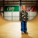 boy standing on skateboard ramp