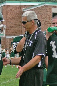 football coach talking to players