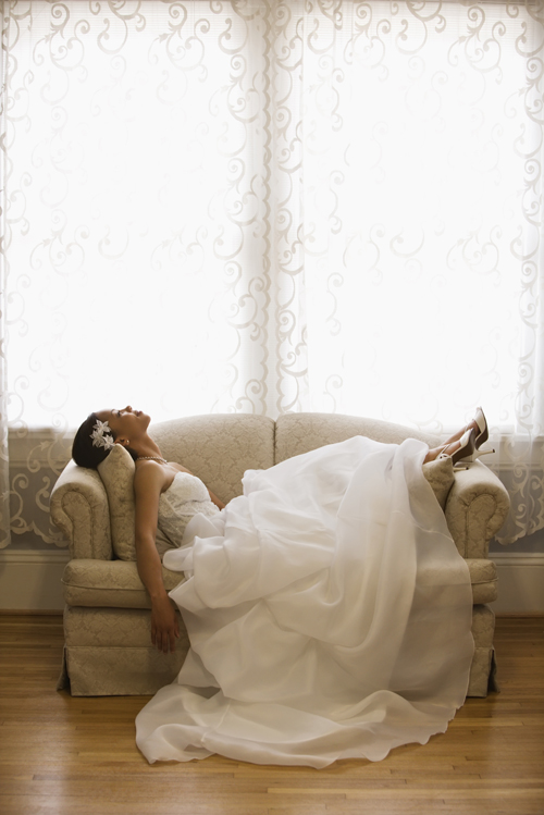 Bride relaxing on a couch