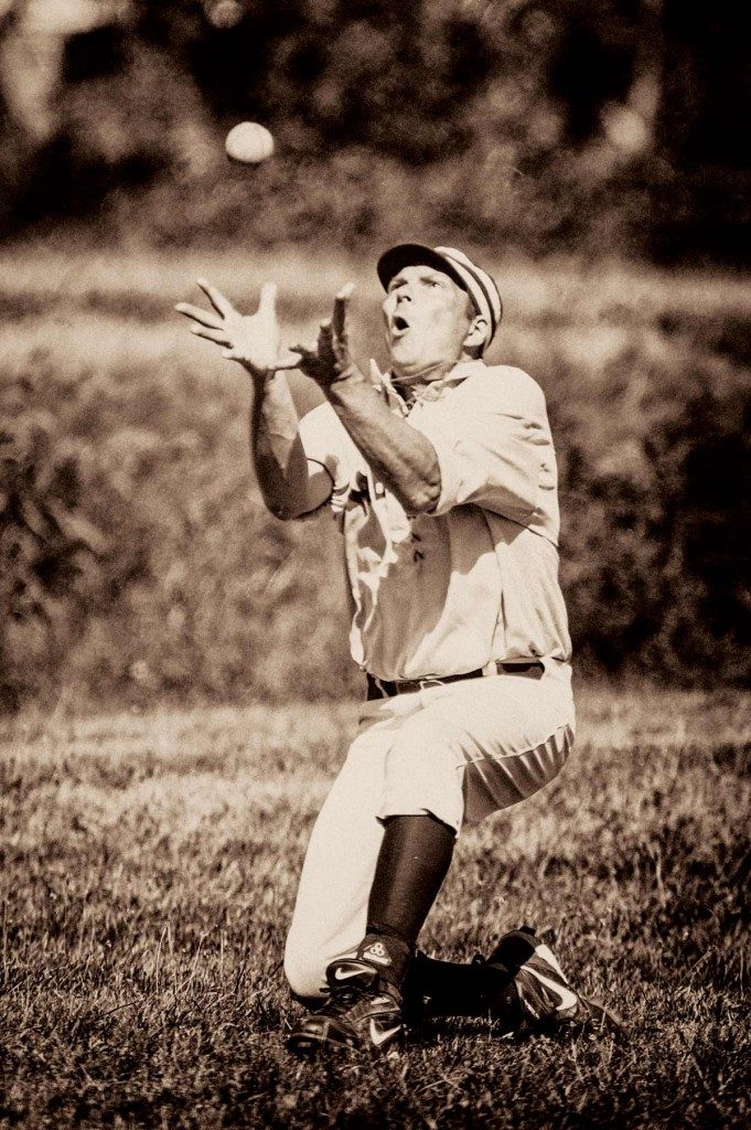 Ture to the past, outfielders play sans gloves.