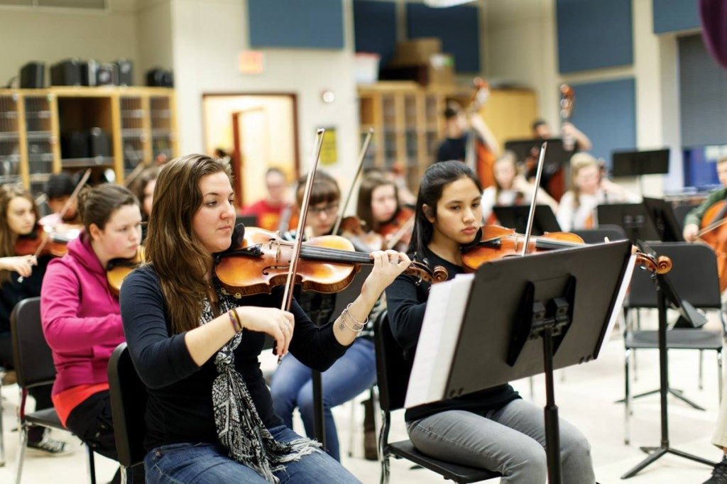 concert master Callie Lerardi in rehearsal